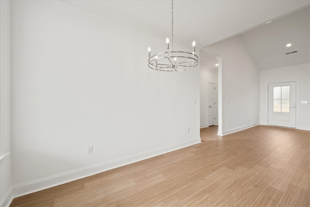108 Oak Grove Road Norris, SC 29667 - Photo 10 of 35 This bright, airy room features vaulted ceilings and light wood flooring, perfect for modern living.