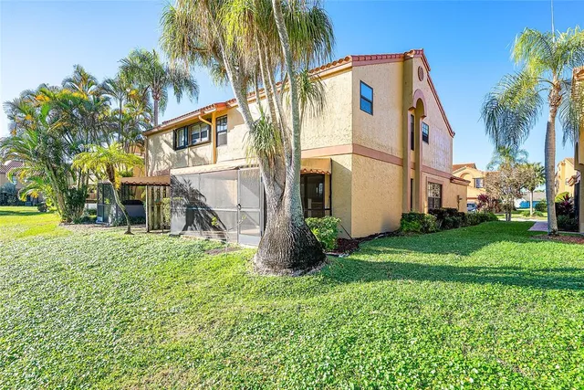 a view of a house with a yard