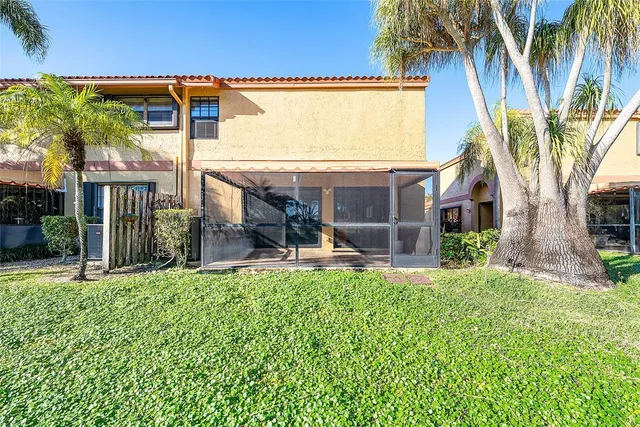 a front view of a house with a yard table and chairs