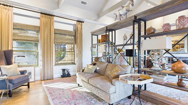 a bedroom with a bed and a night stand