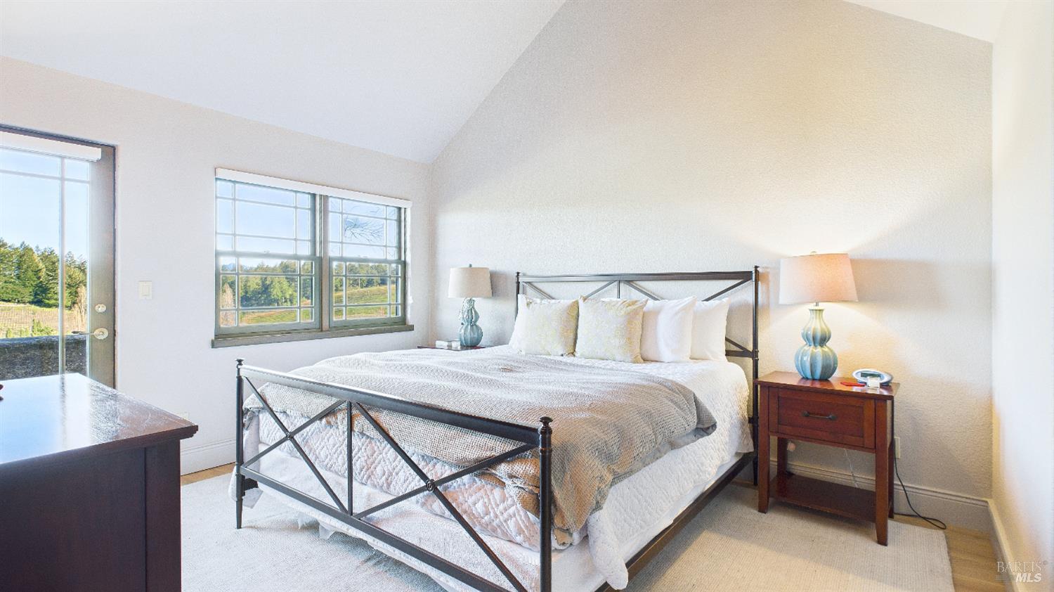 3225 West Dry Creek Road Healdsburg, CA 95448 - Photo 21 of 45 a bedroom with a bed and a table