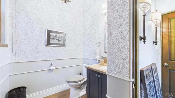 a room with lots of wooden furniture and large windows