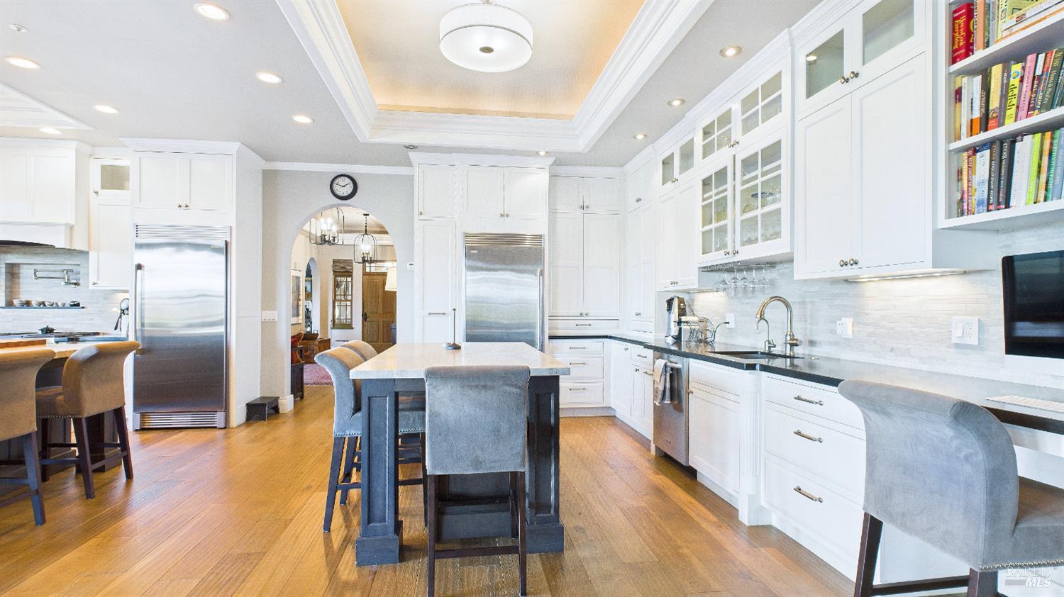 3225 West Dry Creek Road Healdsburg, CA 95448 - Photo 37 of 45 a large kitchen with cabinets chairs and wooden floor
