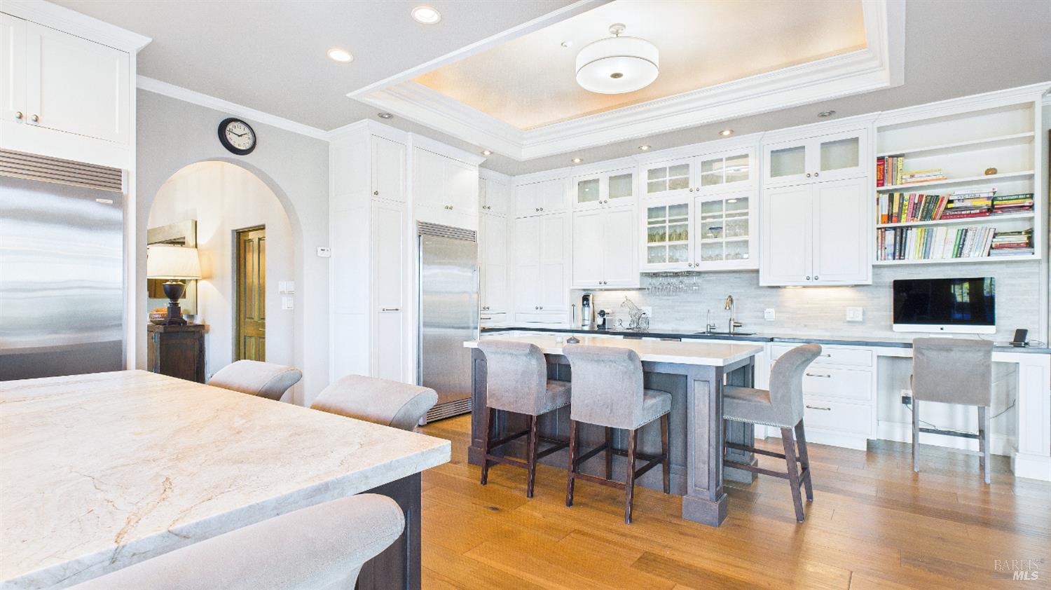 3225 West Dry Creek Road Healdsburg, CA 95448 - Photo 38 of 45 a kitchen with stainless steel appliances kitchen island granite countertop a dining table chairs and a refrigerator