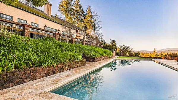a view of a swimming pool with a lake view