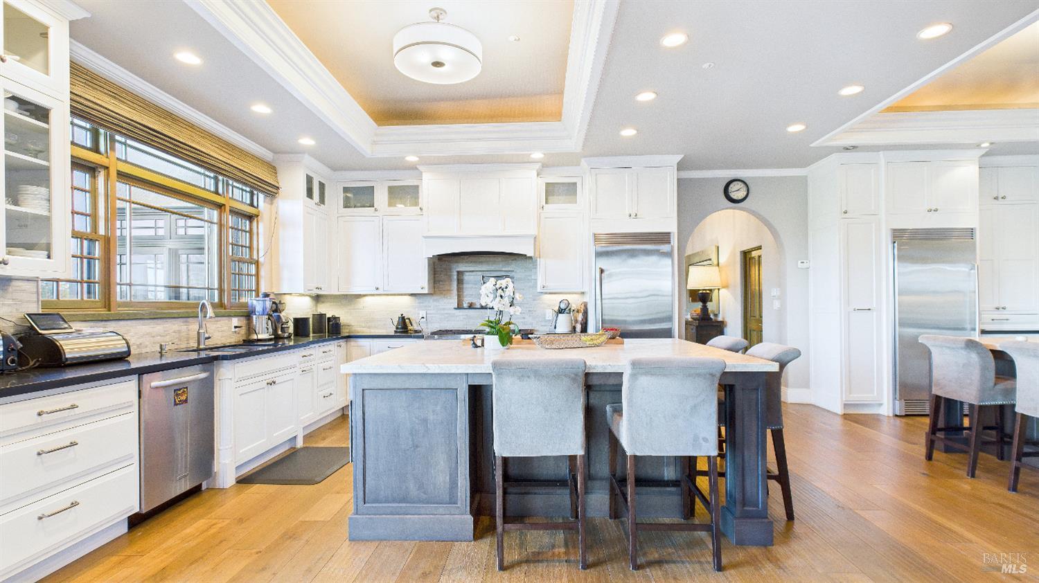 3225 West Dry Creek Road Healdsburg, CA 95448 - Photo 43 of 45 a large kitchen with cabinets a sink a window and chairs