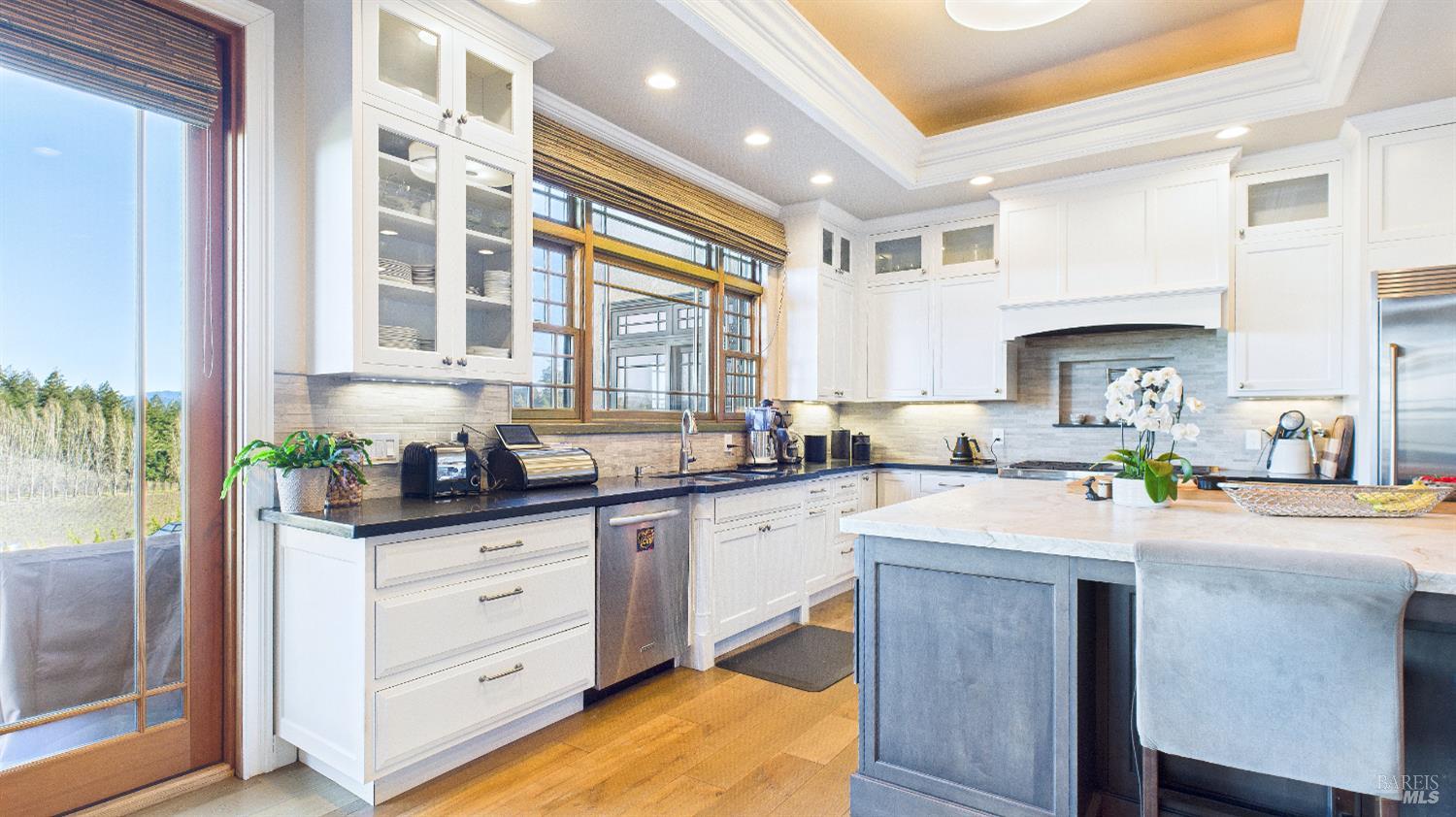 3225 West Dry Creek Road Healdsburg, CA 95448 - Photo 44 of 45 a kitchen with stainless steel appliances granite countertop a sink stove and cabinets