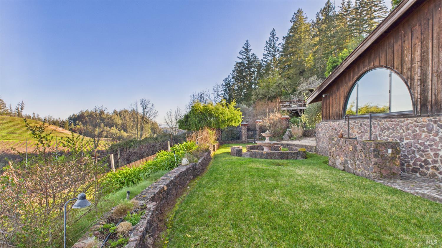 3225 West Dry Creek Road Healdsburg, CA 95448 - Photo 5 of 45 a view of a house with backyard and sitting area