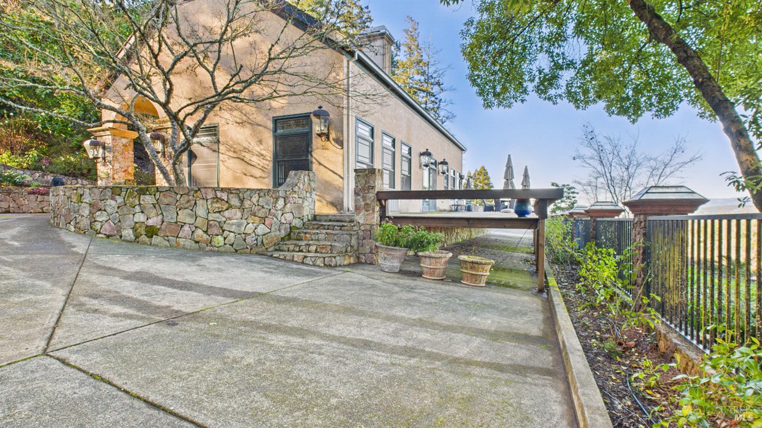3225 West Dry Creek Road Healdsburg, CA 95448 - Photo 8 of 45 a view of a chair and table in the backyard of the house