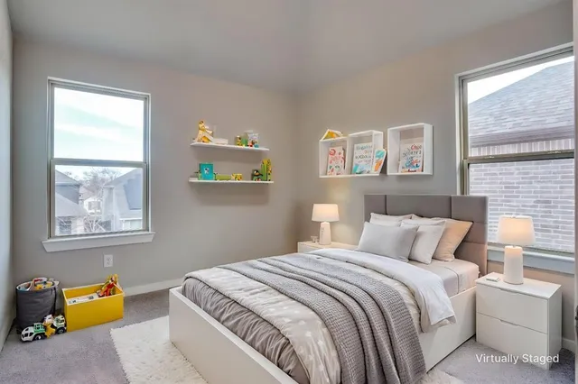 a bedroom with bed and window