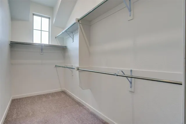 a view of an empty walk in closet
