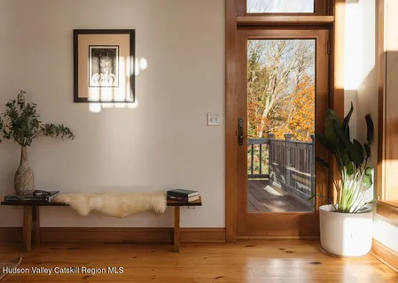 a view of living room filled with furniture and a window