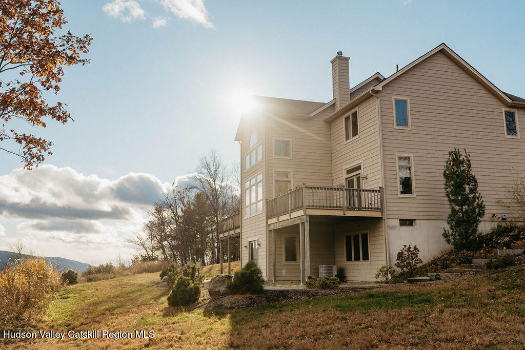 56 Woodland Ridge Road Kerhonkson, NY 12446 - Photo 2 of 31 a view of a white house with large windows
