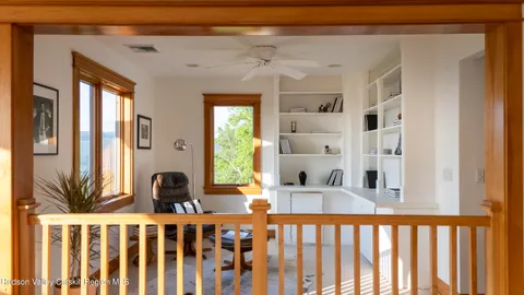 a blue couch sitting in front of a window