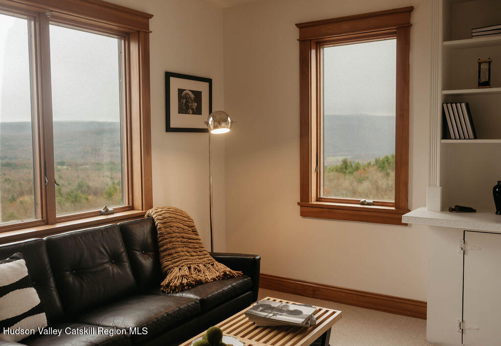 56 Woodland Ridge Road Kerhonkson, NY 12446 - Photo 26 of 31 a blue couch sitting in front of a window