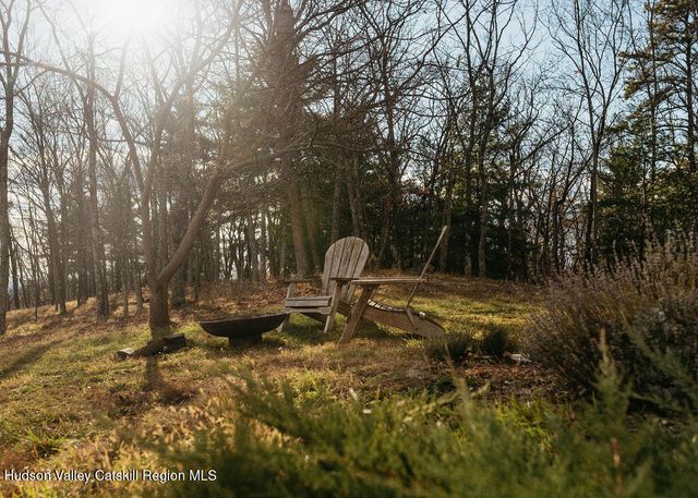 a view of brick house with a small yard