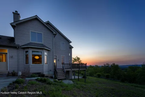 an aerial view of a house with mountain view