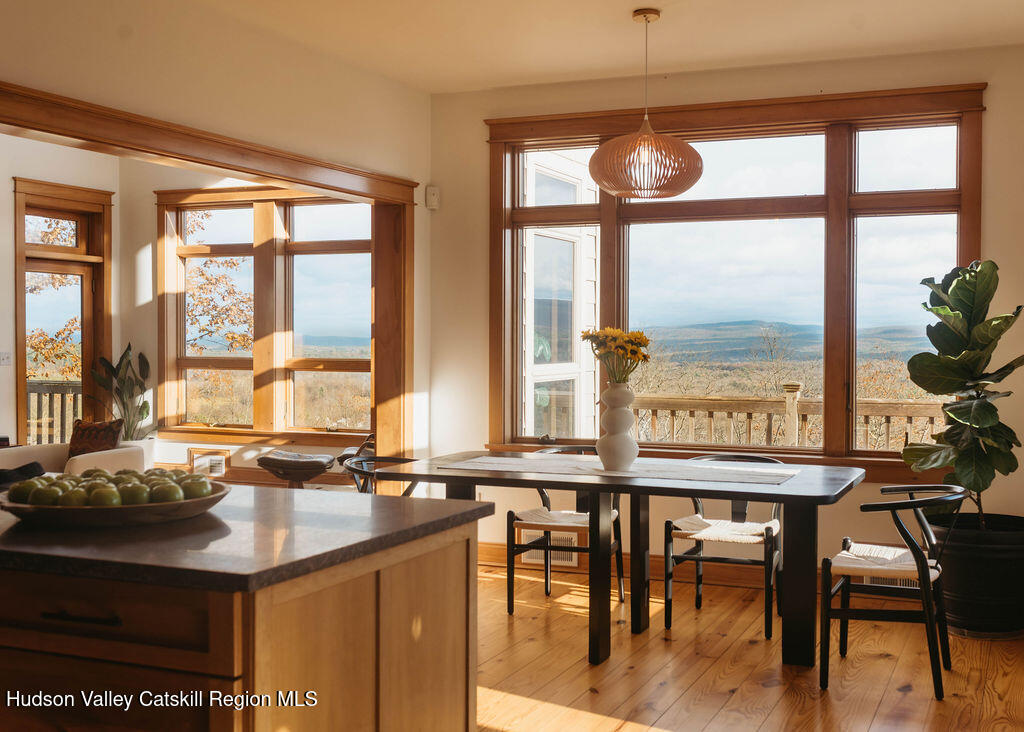 56 Woodland Ridge Road Kerhonkson, NY 12446 - Photo 9 of 31 a kitchen with a large window and dining table
