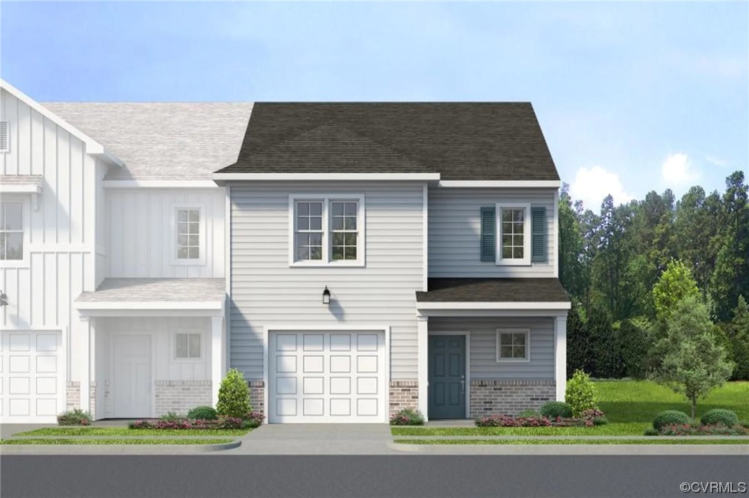 11253 Benton Pointe Way Chester, VA 23831 - Photo 1 of 12 a front view of a house with a garden
