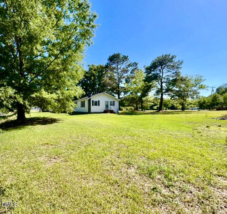 185 Summerhill Road Turkey, NC 28393 - Photo 3 of 18 a house view with swimming pool in front of it