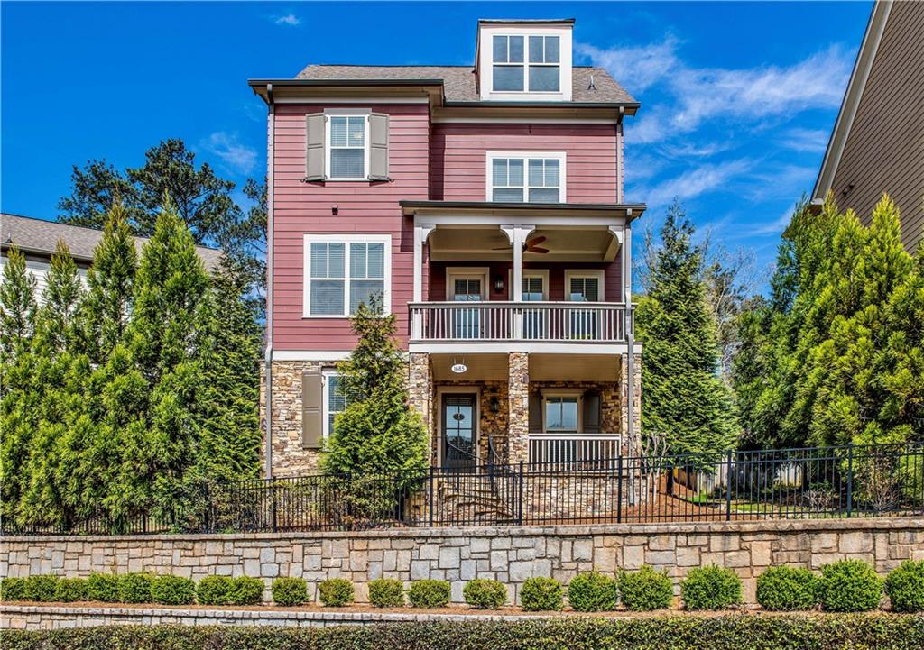 Stately Farmhouse Style home in desirable Mill Creek Preserve.