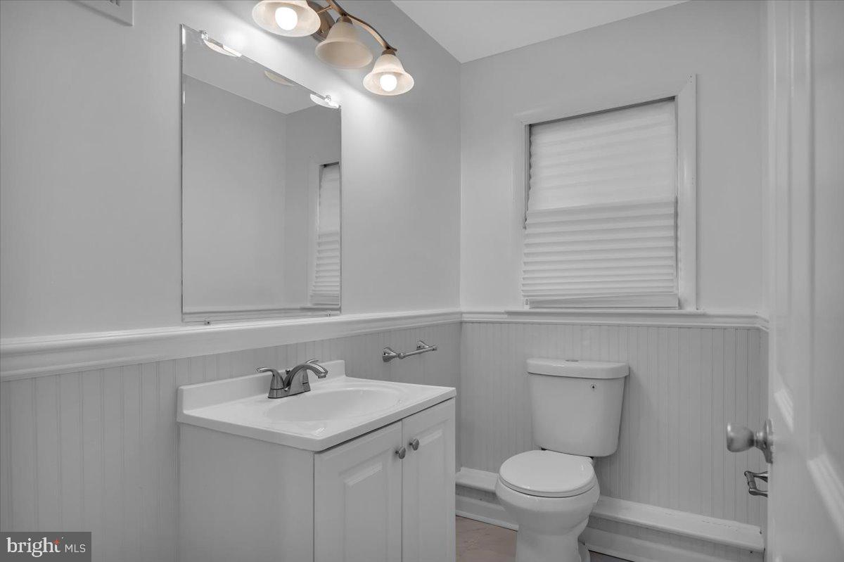 47 Delaware Drive Penns Grove, NJ 08069 - Photo 17 of 38 a bathroom with a sink a toilet and a mirror