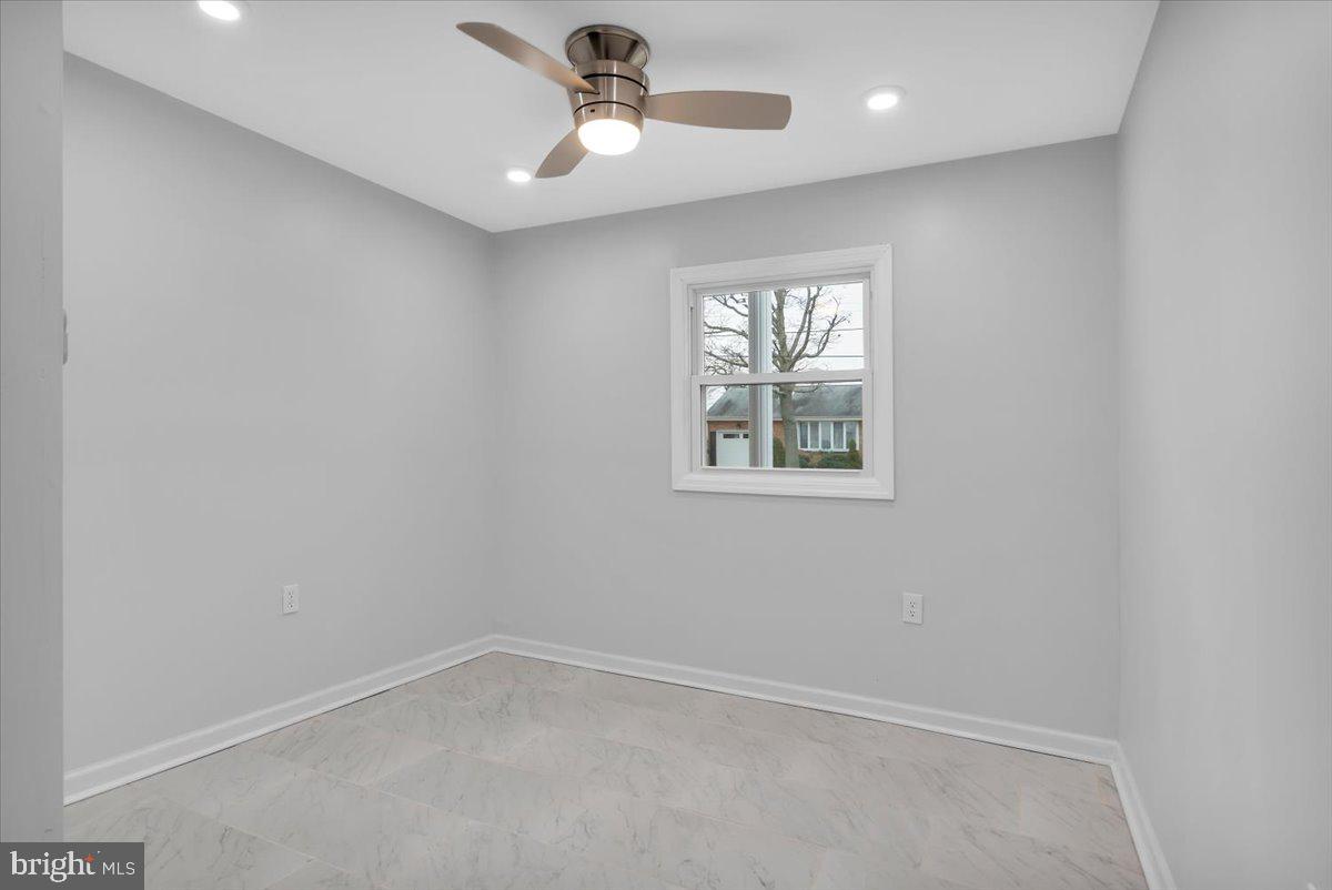 47 Delaware Drive Penns Grove, NJ 08069 - Photo 18 of 38 an empty room with a window and a fan