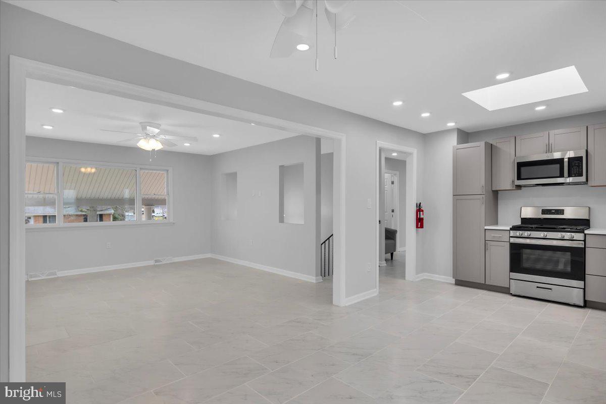 47 Delaware Drive Penns Grove, NJ 08069 - Photo 26 of 38 a view of a kitchen with stainless steel appliances granite countertop a refrigerator a stove and a sink