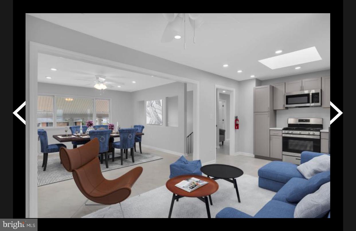 47 Delaware Drive Penns Grove, NJ 08069 - Photo 36 of 38 a living room with furniture kitchen view and a refrigerator