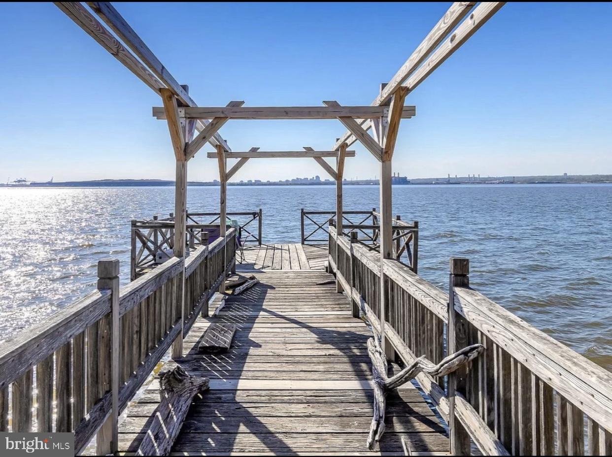 47 Delaware Drive Penns Grove, NJ 08069 - Photo 38 of 38 a view of balcony with wooden floor and fence