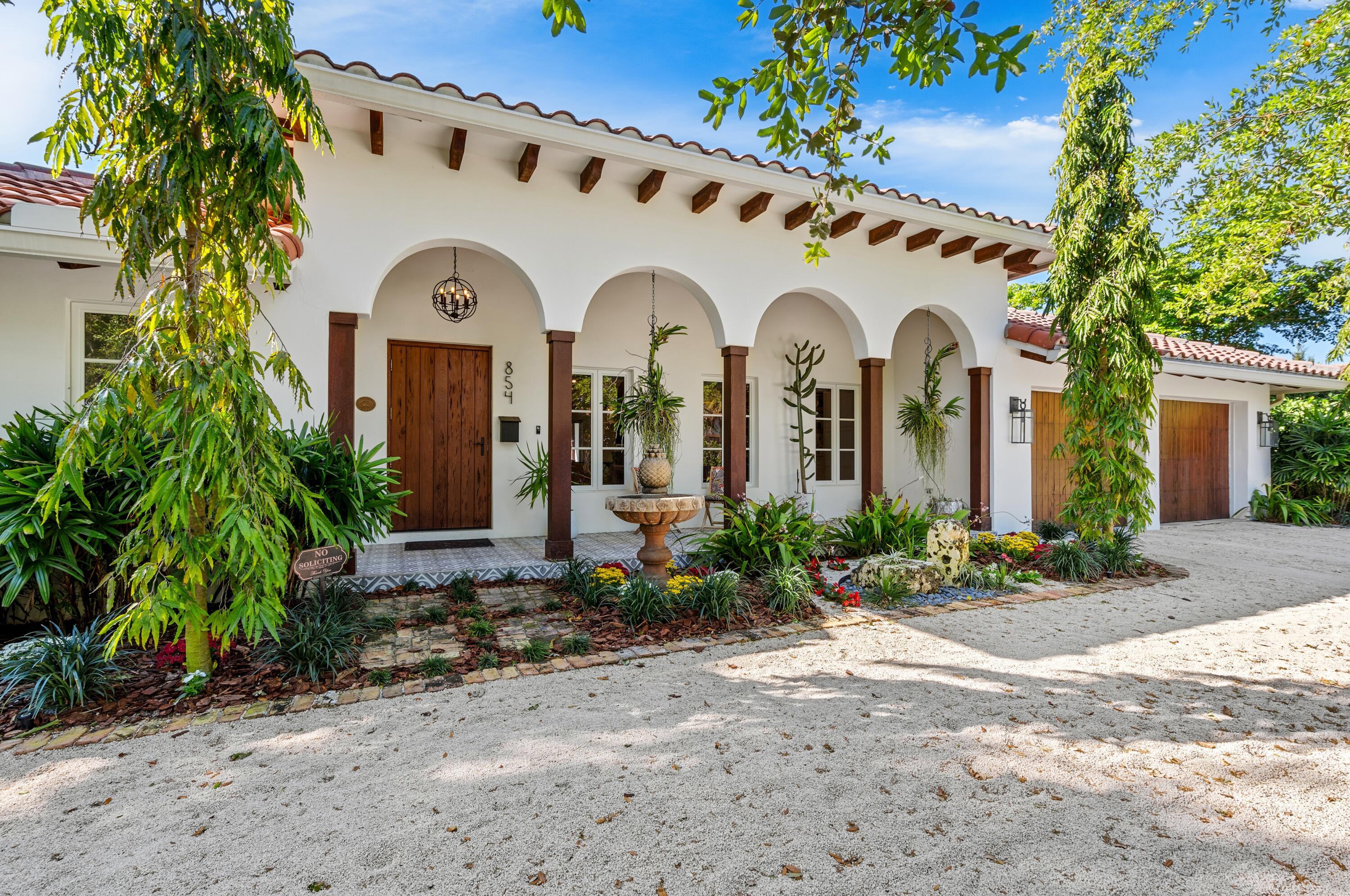 854 Hibiscus Street Boca Raton, FL 33486 - Photo 1 of 1 a front view of a house with garden