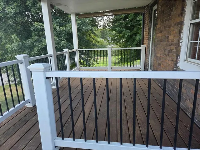 a view of balcony with furniture