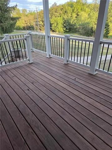 a balcony with wooden floor