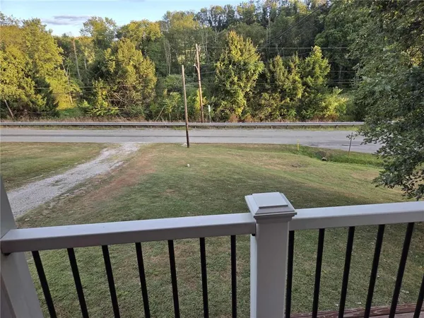 a view of a balcony with an outdoor space