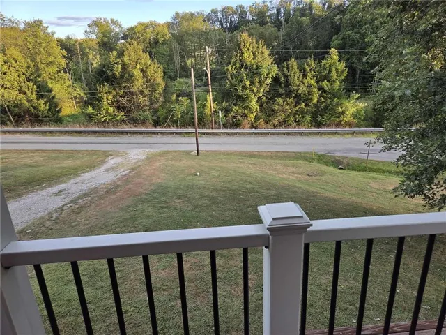 a view of a balcony with an outdoor space