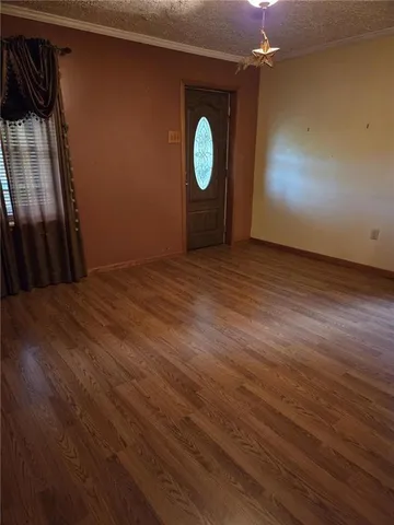 a view of a livingroom with wooden floor