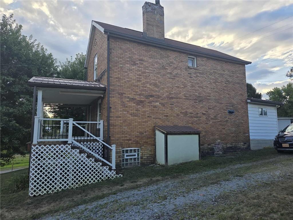 255 Francis Mine State Road Burgettstown, PA 15021 - Photo 3 of 33 a brick house with a small yard and large trees