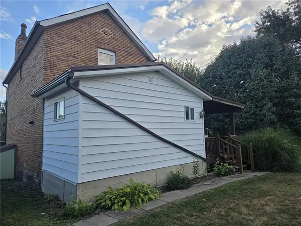 a backyard of a house with lots of green space