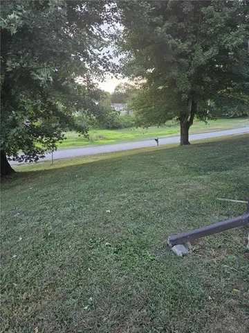 a view of outdoor space with deck and yard