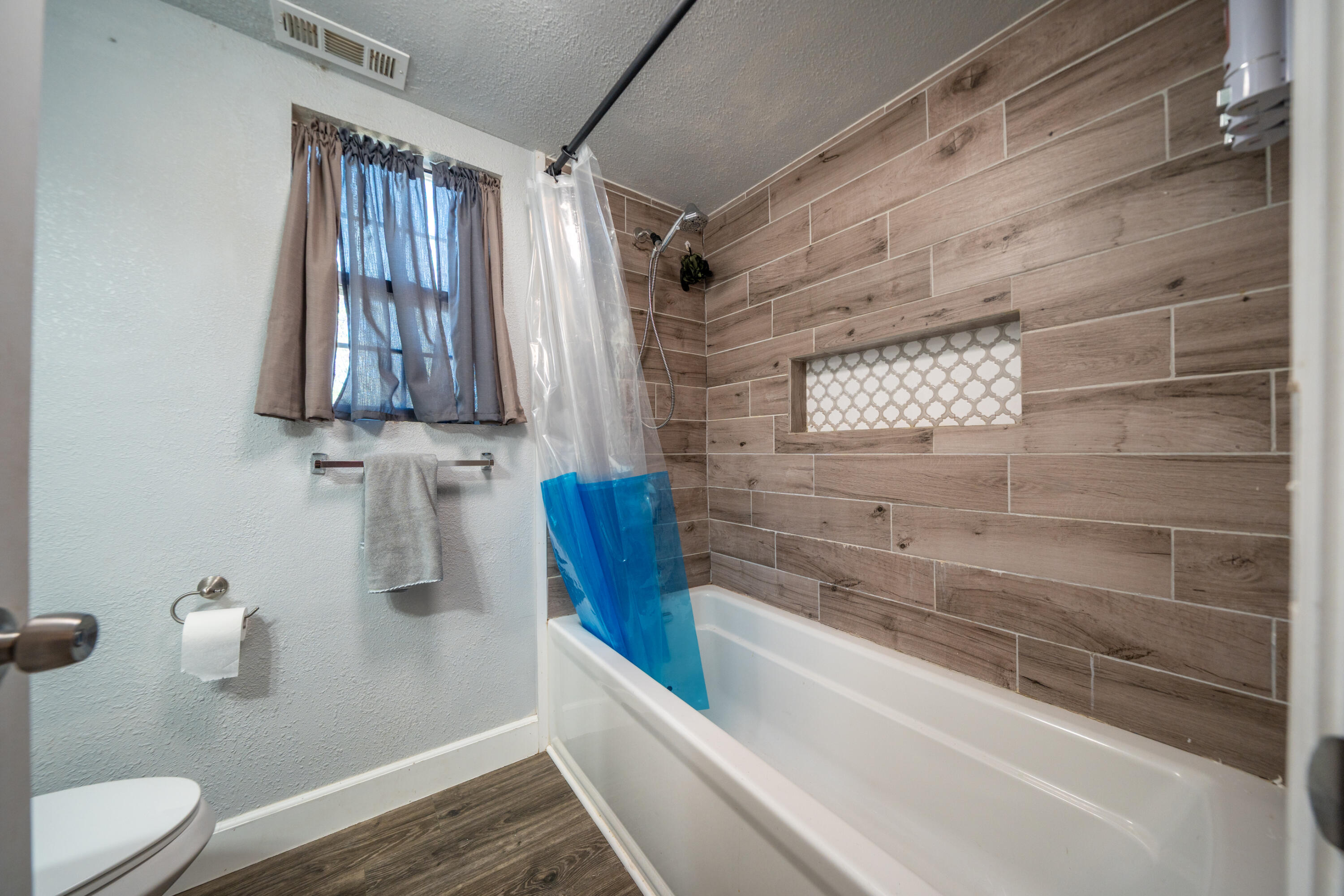 1158 Madison Street Red Bluff, CA 96080 - Photo 12 of 36 a bathroom with a shower and a sink