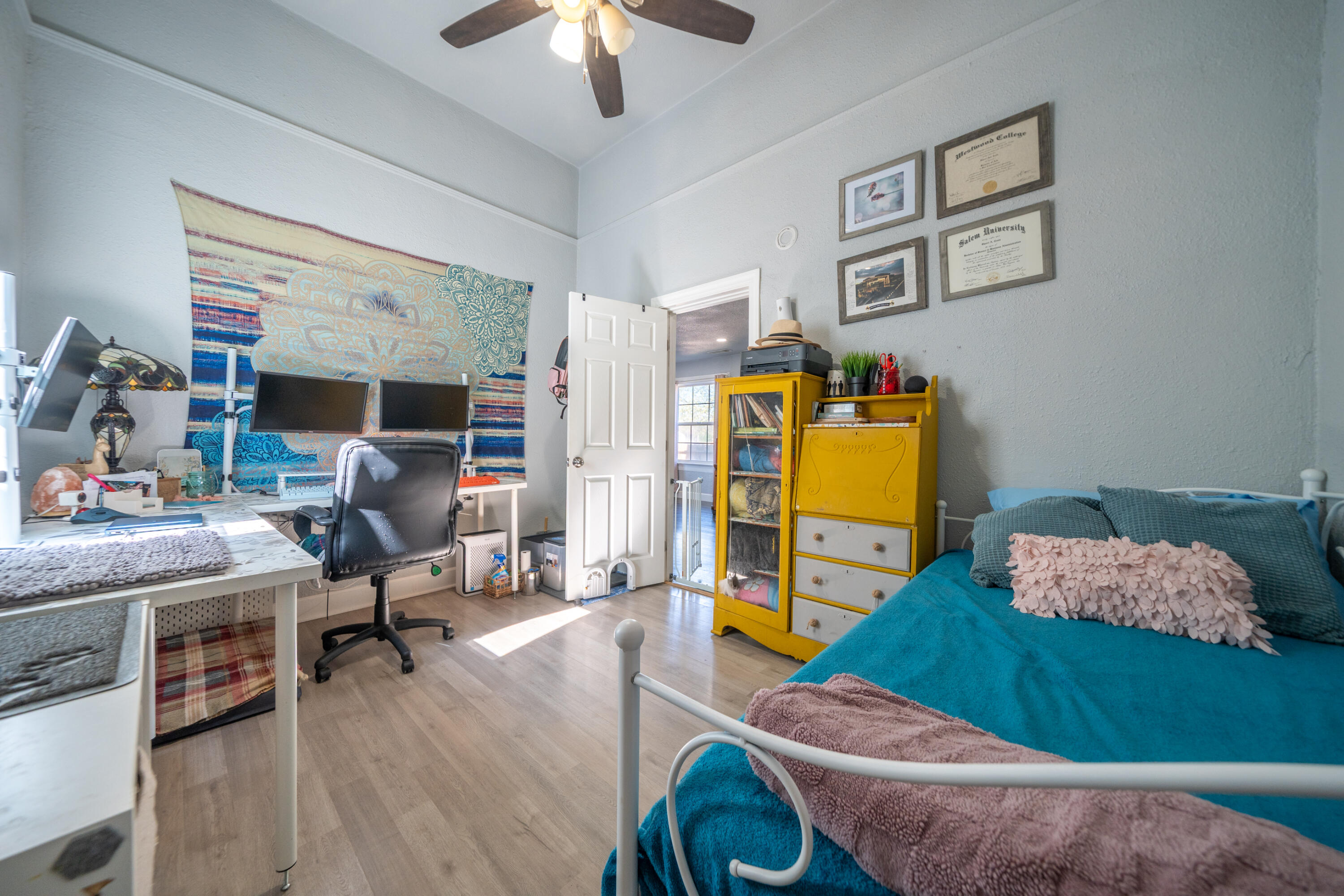 1158 Madison Street Red Bluff, CA 96080 - Photo 13 of 36 a room with furniture and a wooden floor
