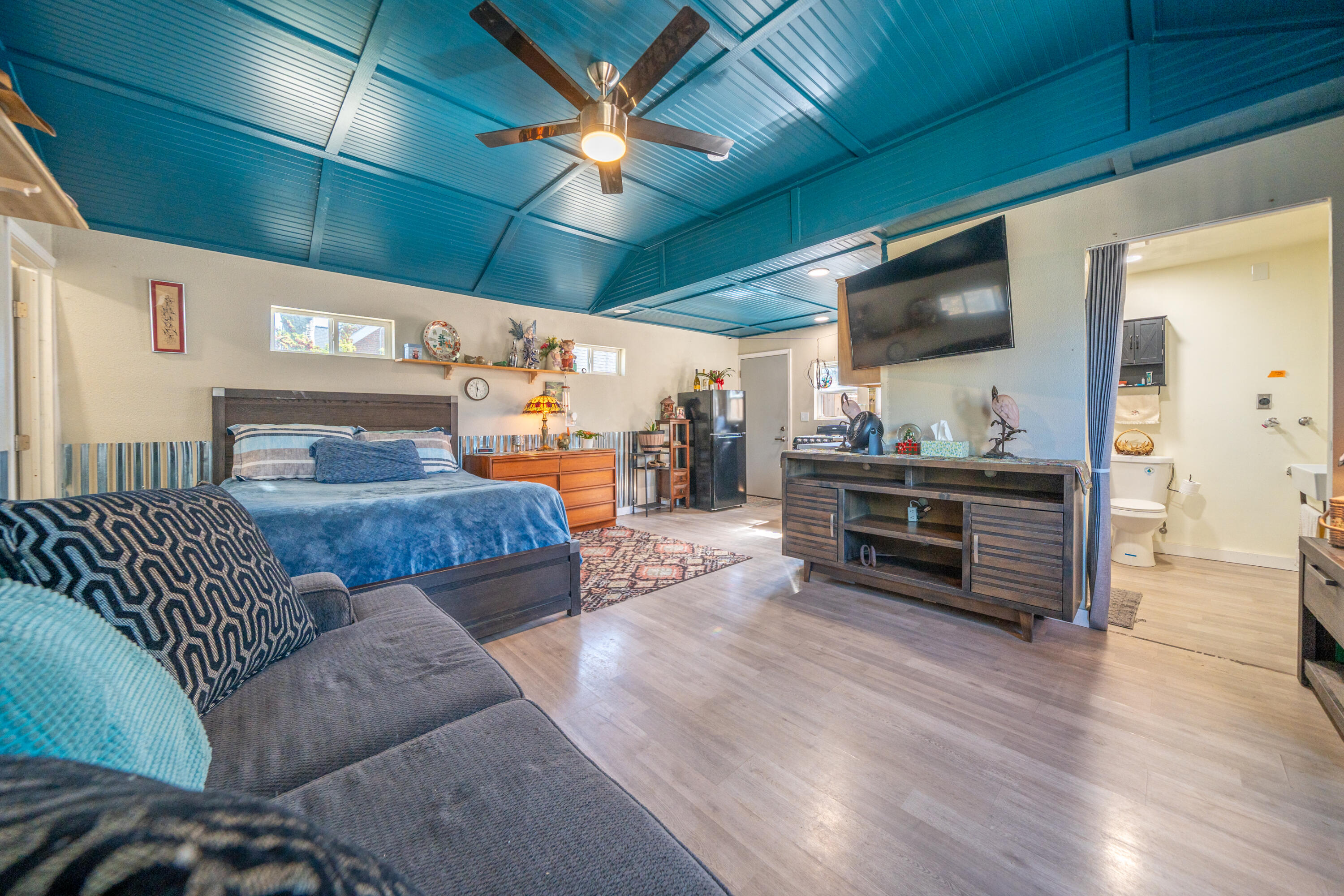 1158 Madison Street Red Bluff, CA 96080 - Photo 19 of 36 a living room with furniture and a flat screen tv