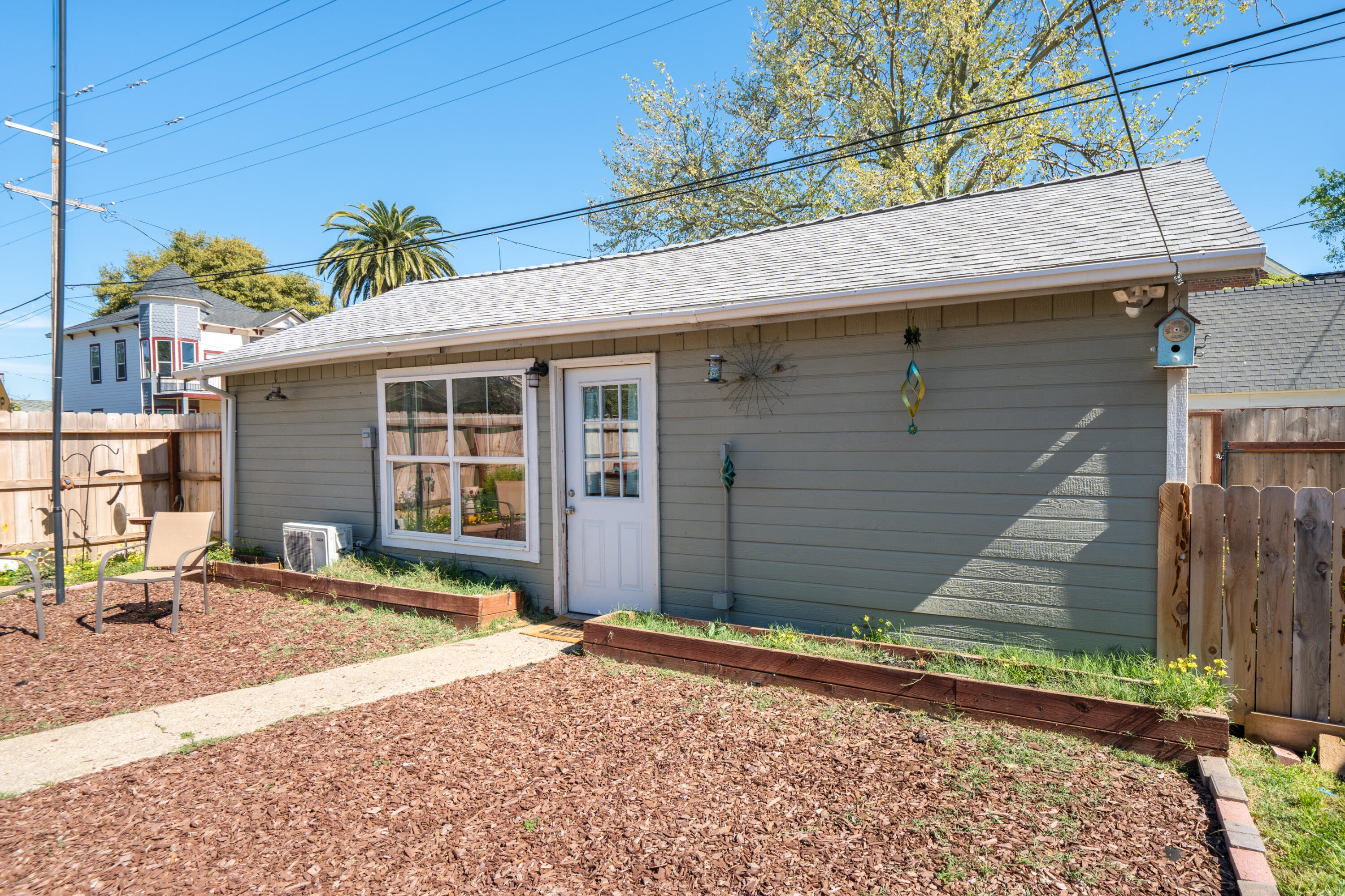 1158 Madison Street Red Bluff, CA 96080 - Photo 20 of 36 a front view of a house with a yard and garage