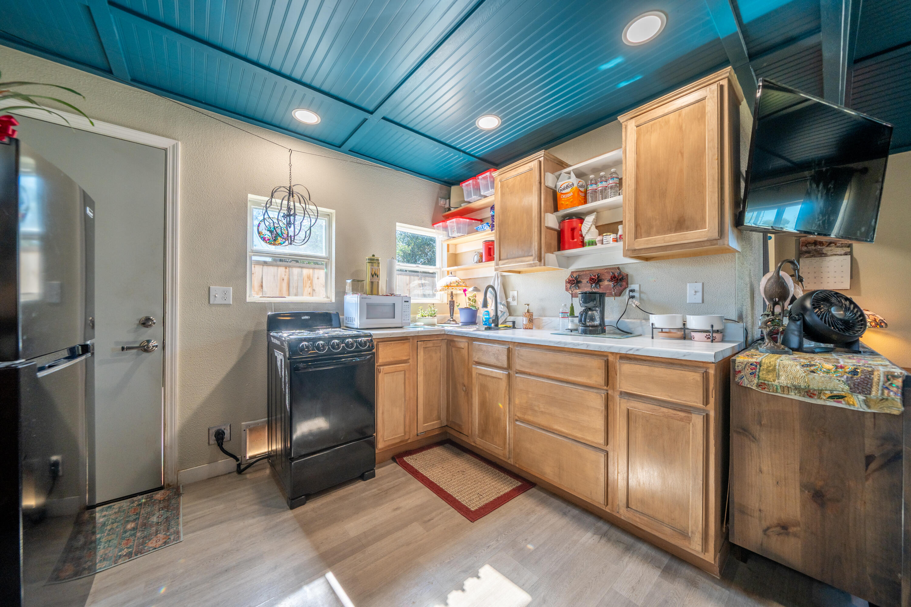 1158 Madison Street Red Bluff, CA 96080 - Photo 22 of 36 a kitchen with stainless steel appliances granite countertop a sink stove and cabinets
