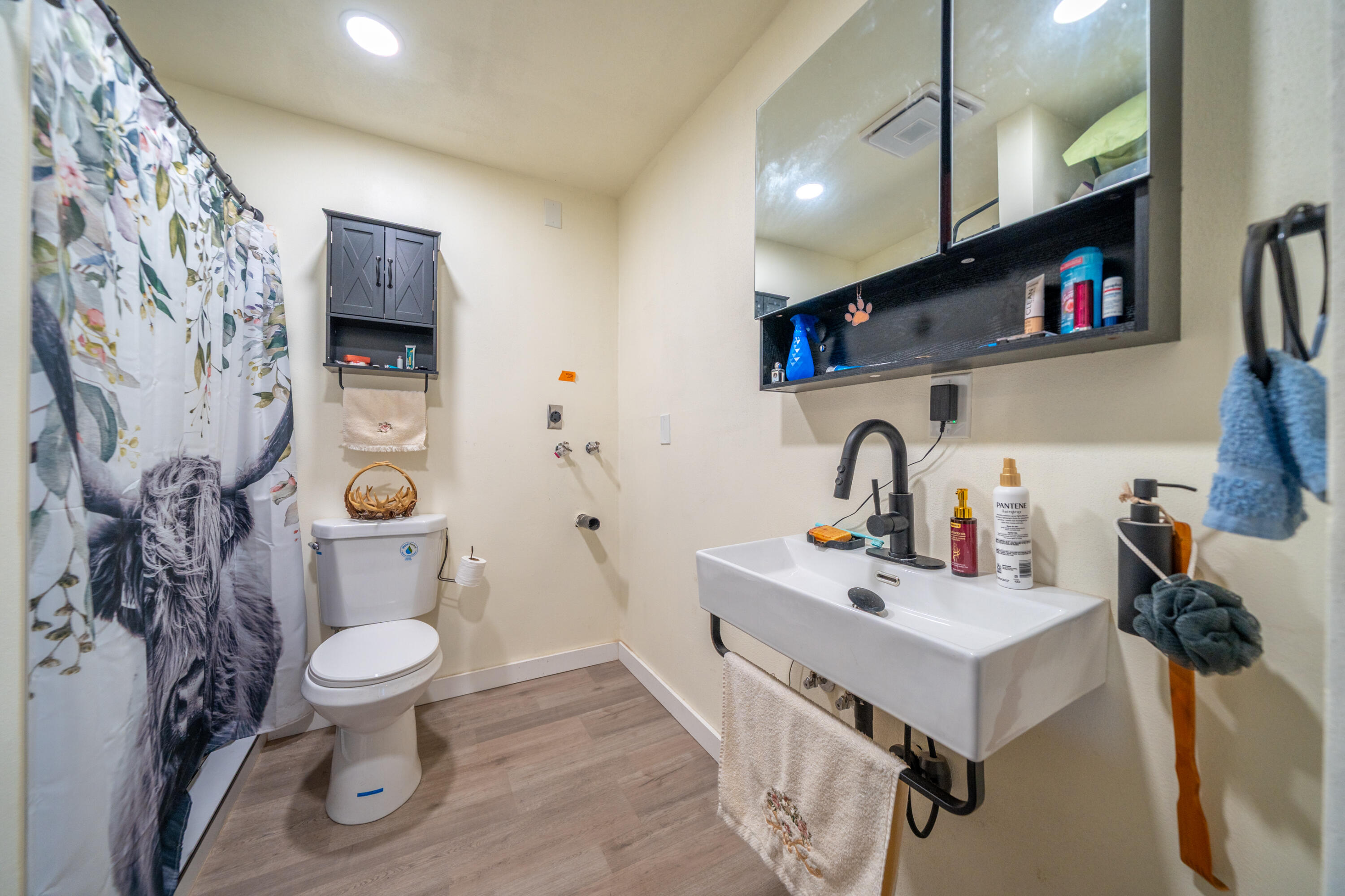 1158 Madison Street Red Bluff, CA 96080 - Photo 24 of 36 a bathroom with a sink toilet and a mirror