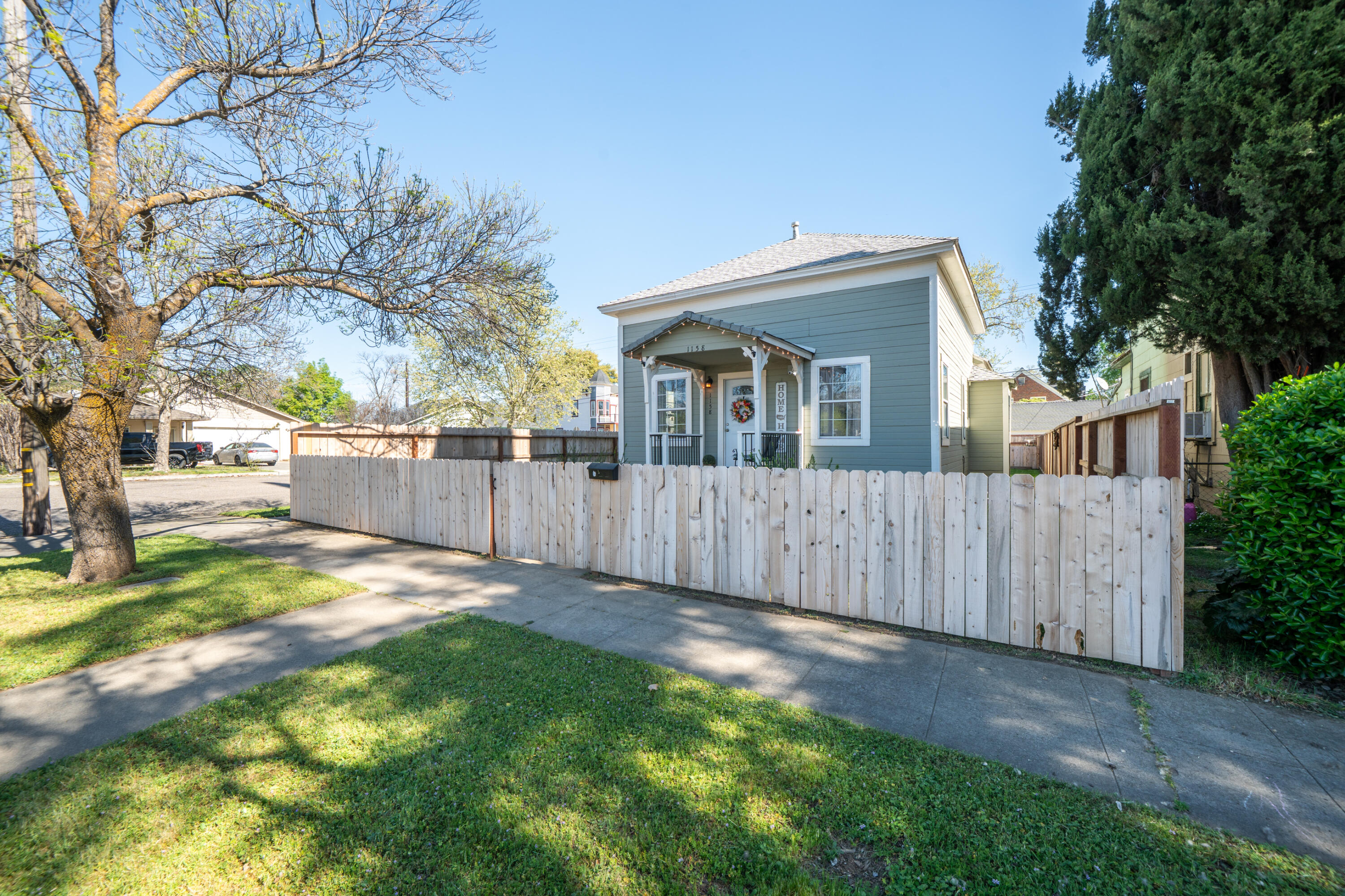 1158 Madison Street Red Bluff, CA 96080 - Photo 29 of 36 a front view of a house with a yard and garage
