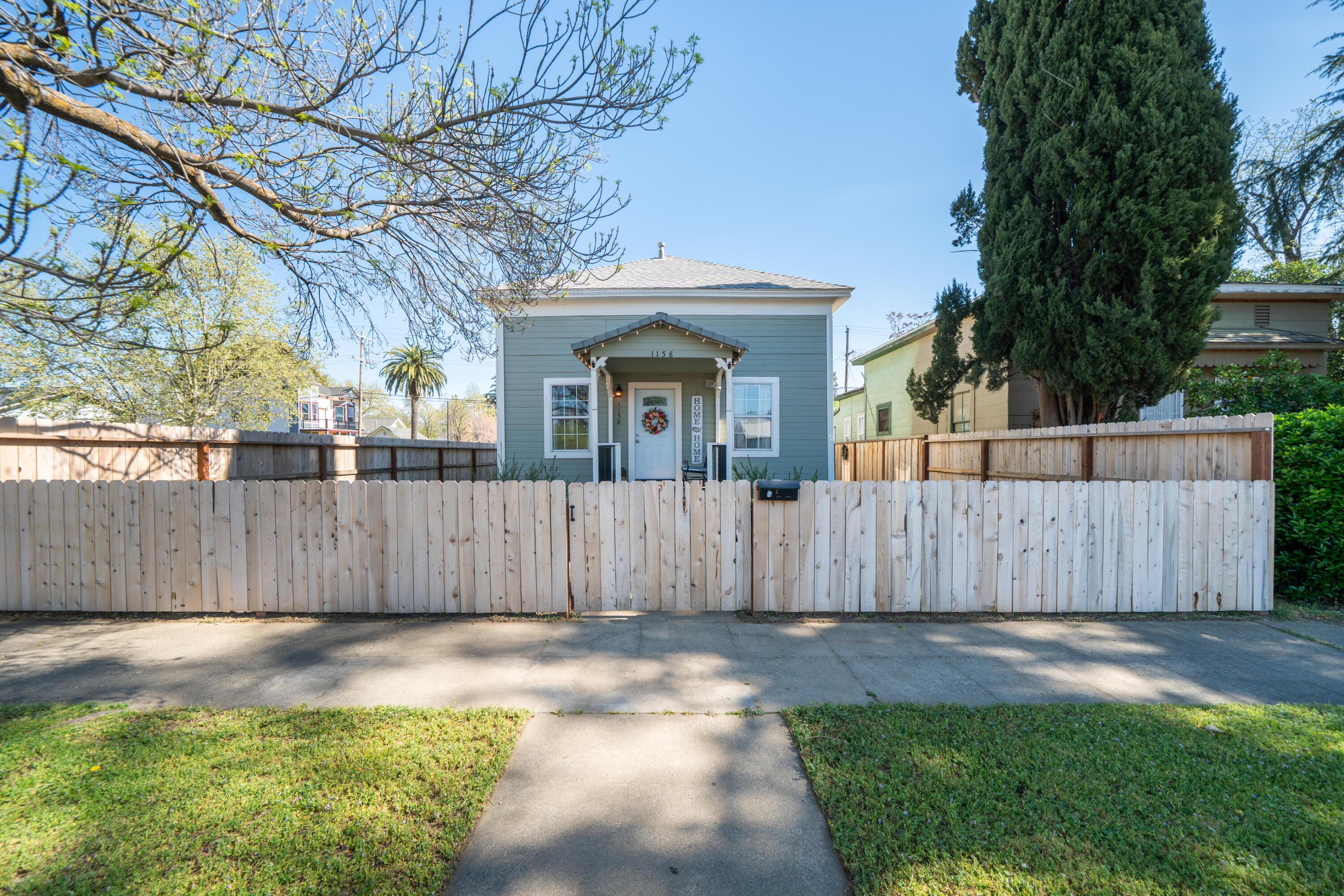 1158 Madison Street Red Bluff, CA 96080 - Photo 31 of 36 a front view of a house with a yard