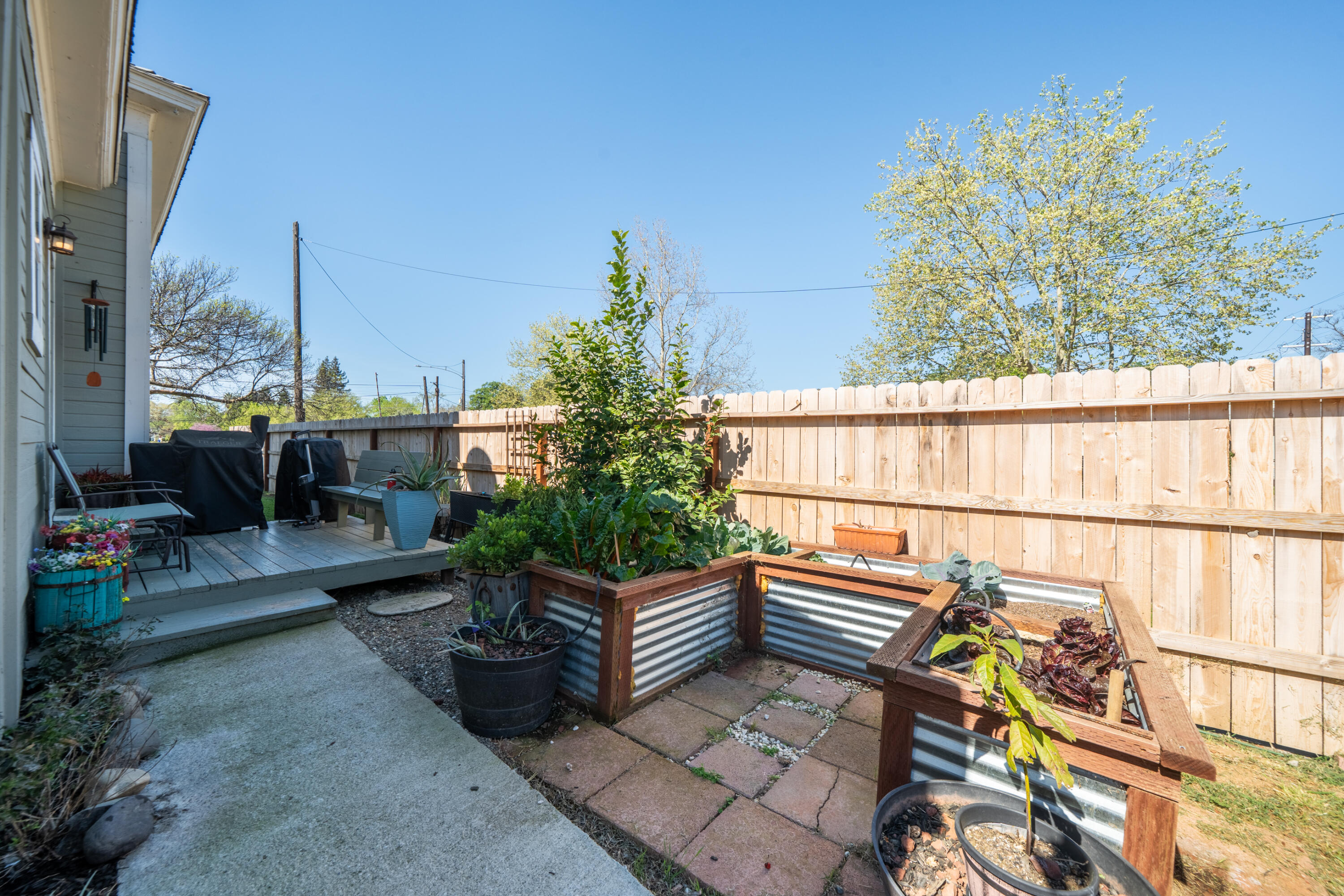 1158 Madison Street Red Bluff, CA 96080 - Photo 32 of 36 a view of a balcony with chairs and potted plants