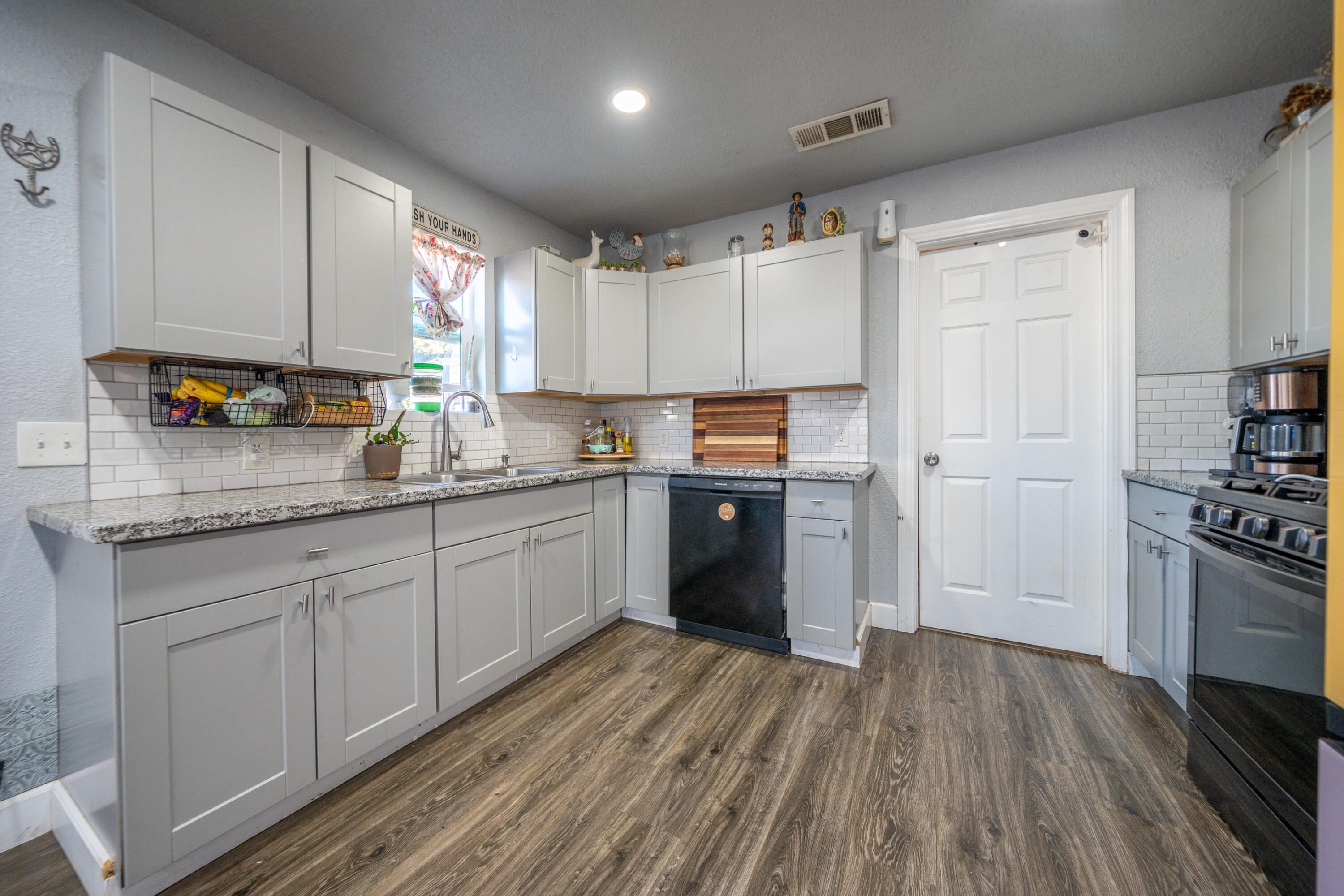 1158 Madison Street Red Bluff, CA 96080 - Photo 4 of 36 a kitchen with stainless steel appliances a refrigerator sink and cabinets