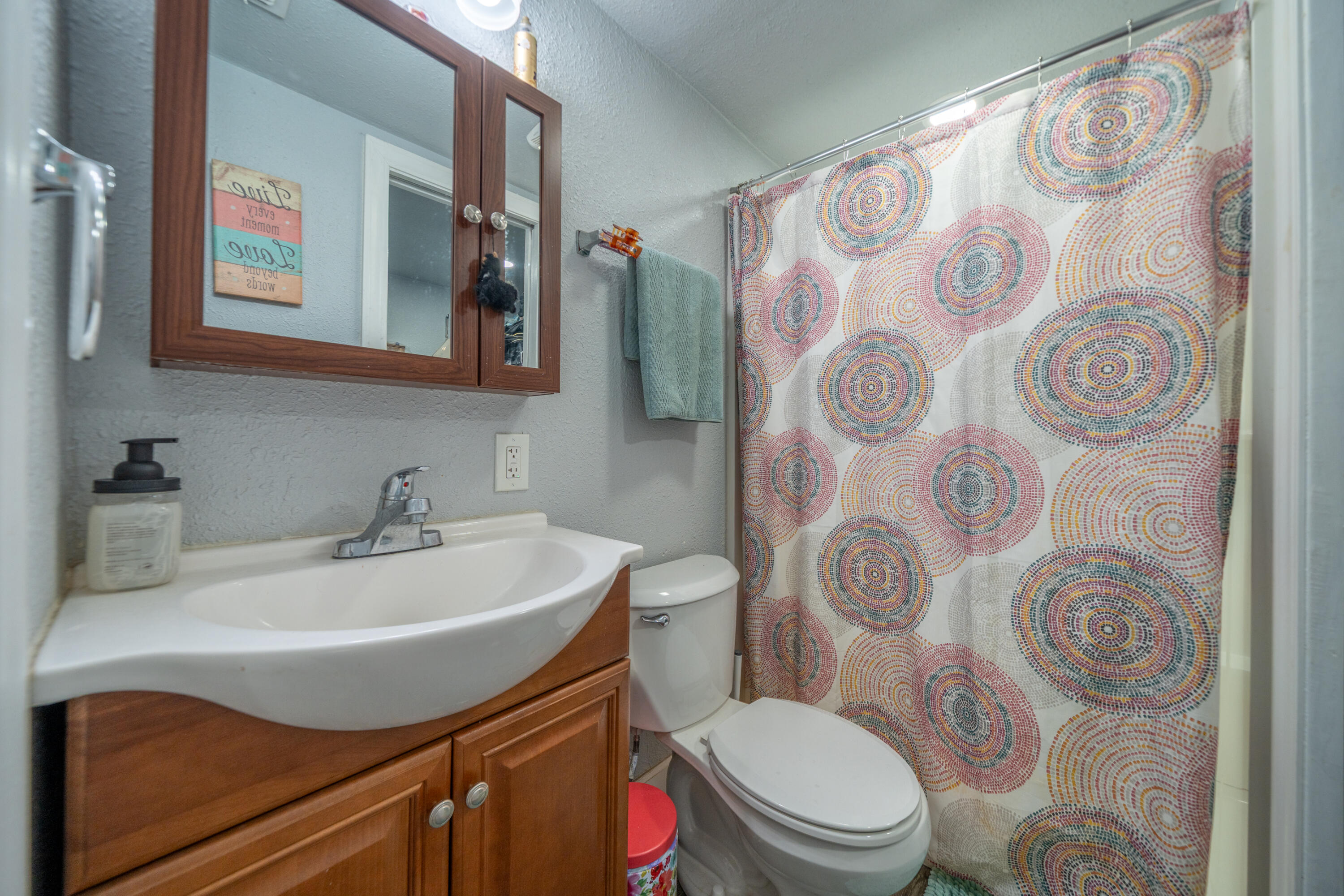 1158 Madison Street Red Bluff, CA 96080 - Photo 9 of 36 a bathroom with a sink toilet and shower